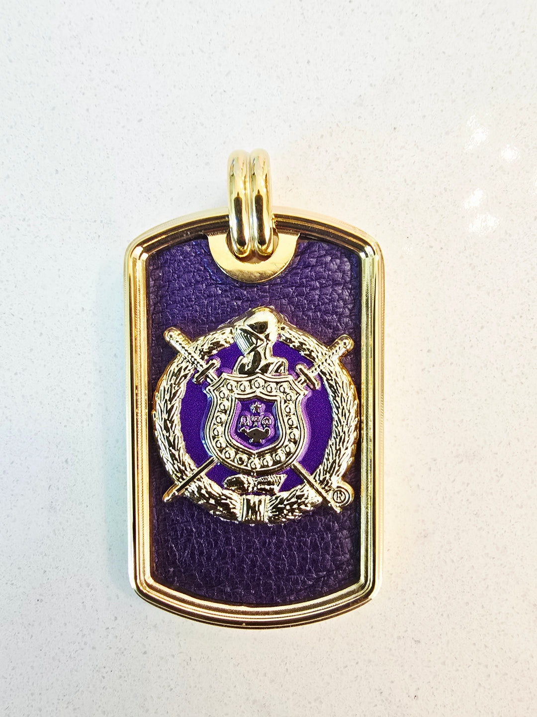Omega Phi Phi Escutcheon leather inlay tag