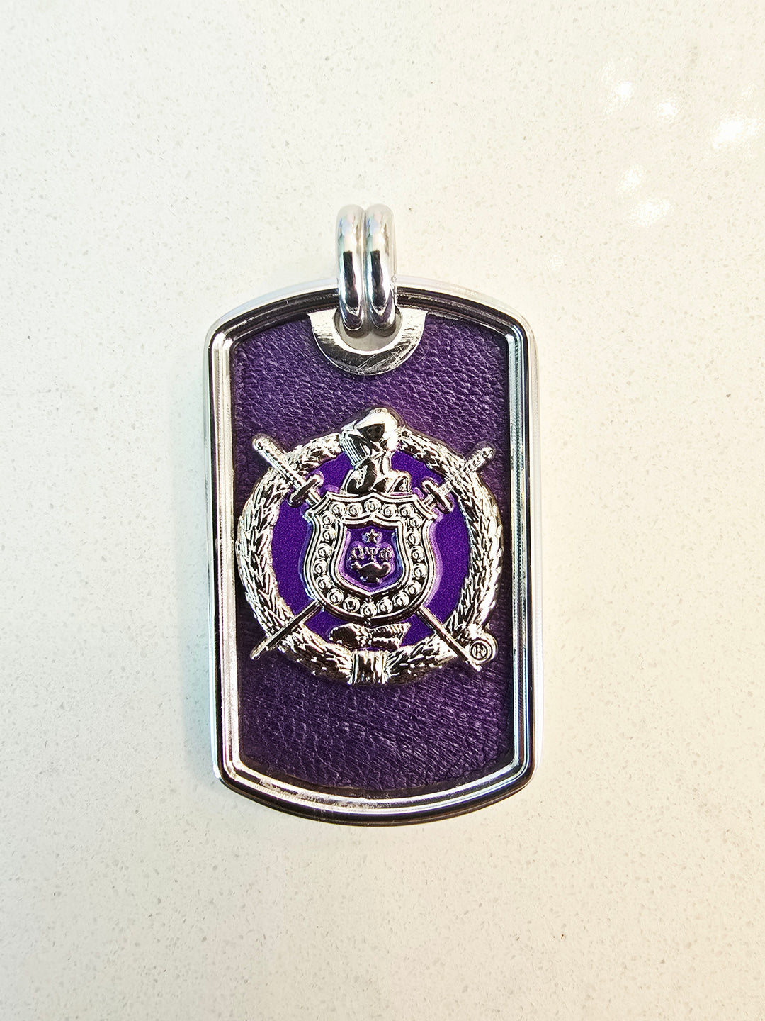 Omega Phi Phi Escutcheon leather inlay tag