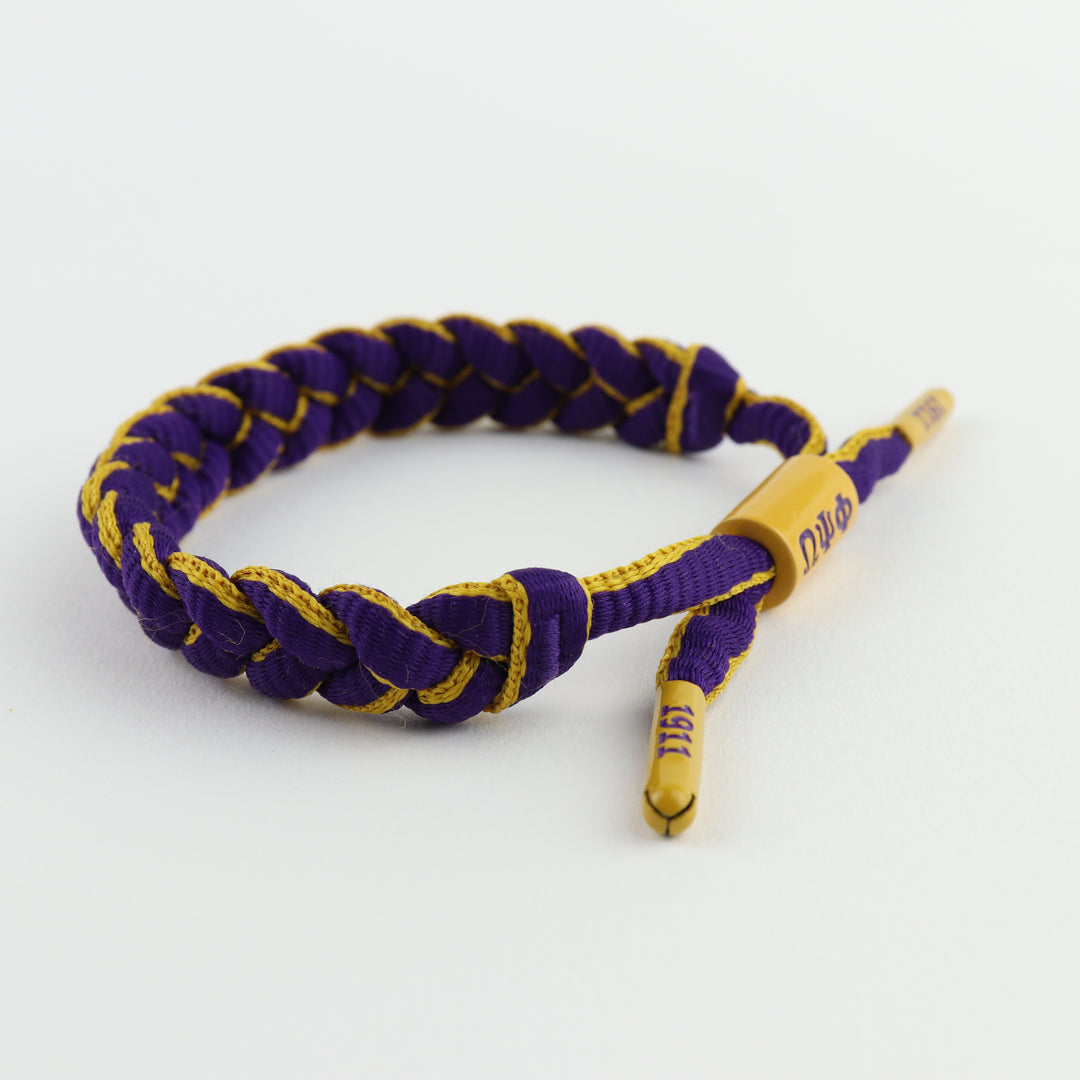 Omega Psi Phi bracelet featuring ΩΨΦ centerpiece and end caps embossed with 1911 braided paracord, adjustable, gift for Omegas, Da Bruhz only at www.thesandz.com